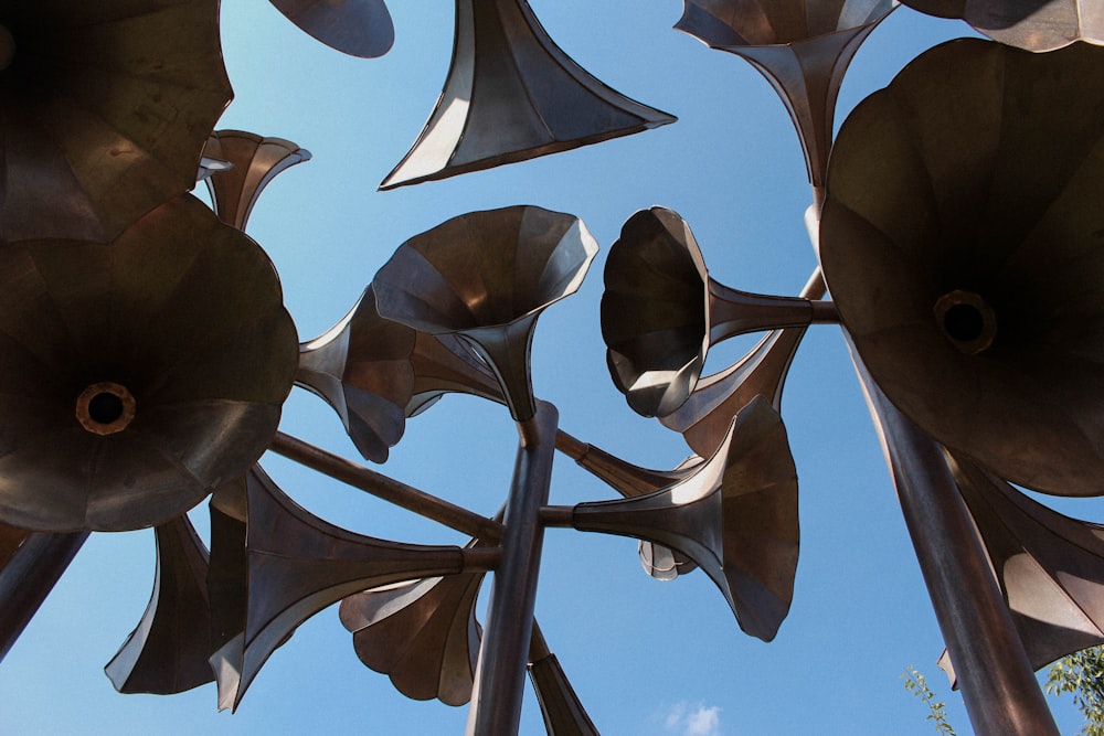 low-angle photography of round silver megaphones