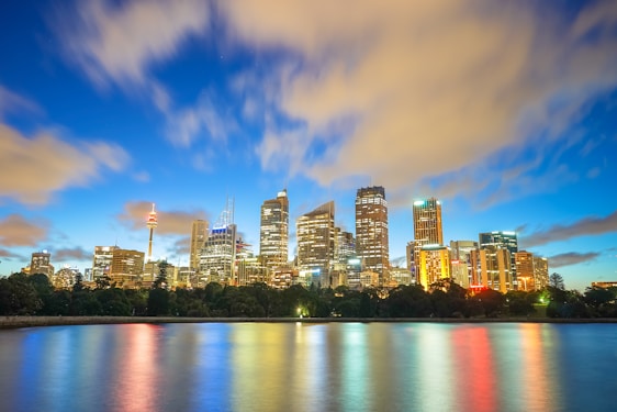 A sleek city skyline at dusk with golden lights reflecting luxury and opportunity.