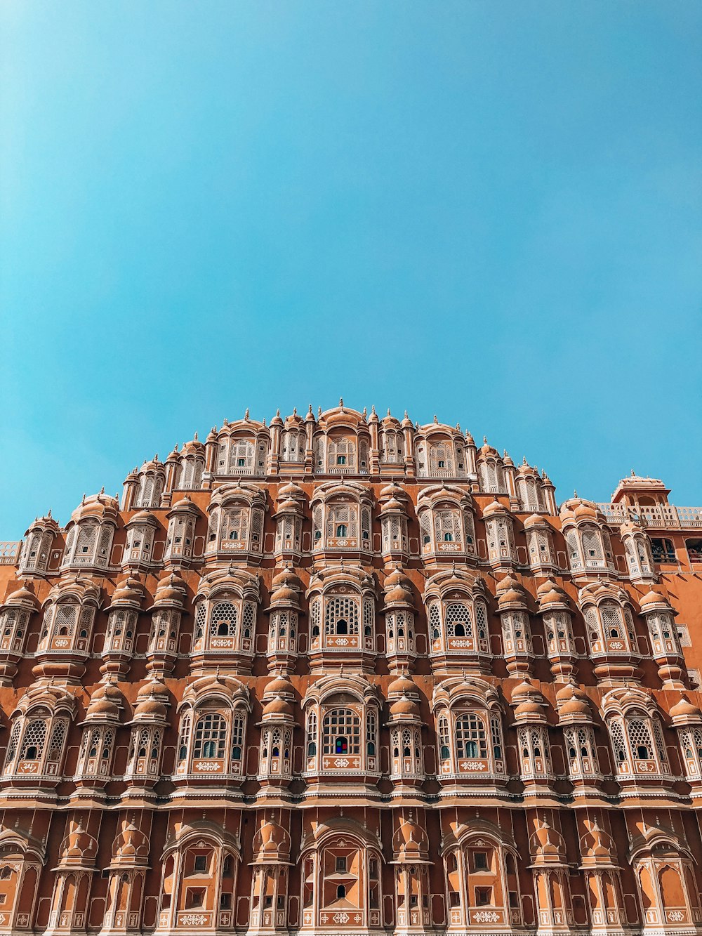 brown India landmark under blue sky