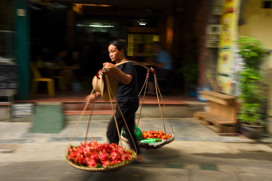 woman carrying stick basket