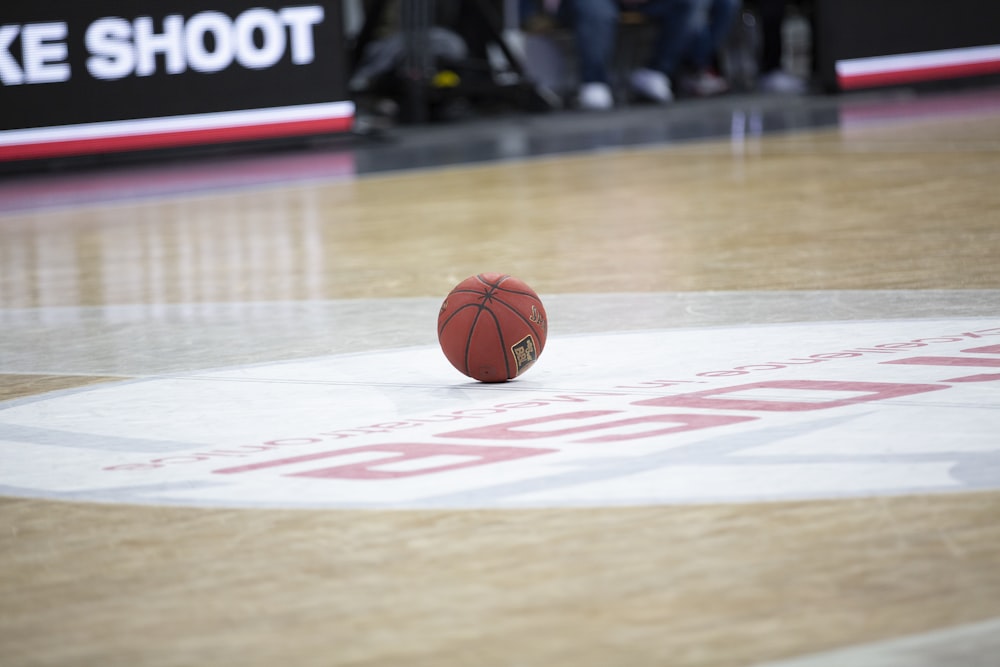 red basketball on basketball court