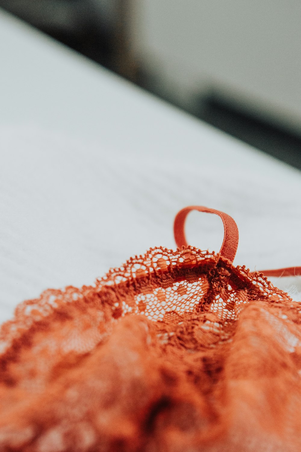 an orange piece of cloth with a knot on it