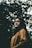woman in black scarf and brown button-up long-sleeved top under trees