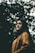 woman in black scarf and brown button-up long-sleeved top under trees