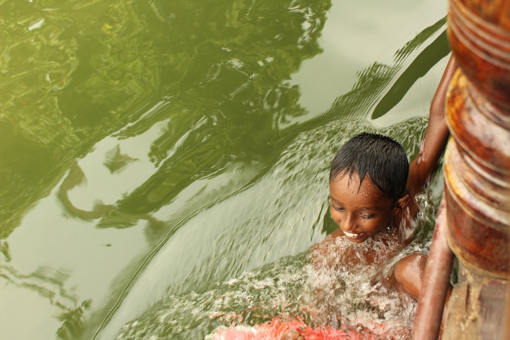 boy in body of water