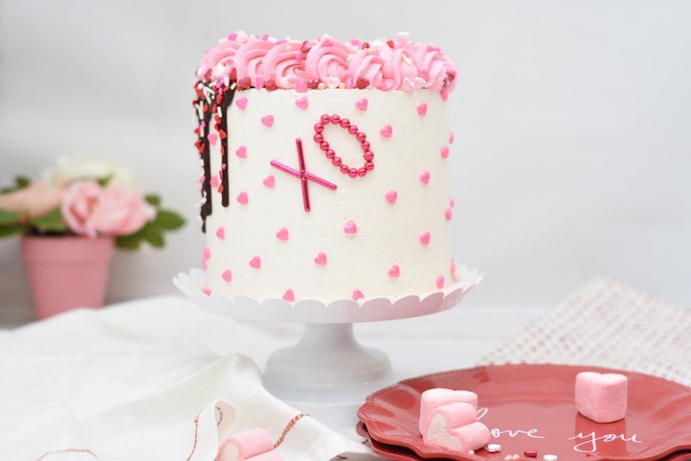 round white and pink icing-covered cake