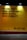 A large, bold statement on a yellow background conveys a motivational message. The text includes the phrases 'We can create more opportunity, more access, more visibility' in capital letters. The words 'So let's go.' are placed separately in the lower right corner, also in capital letters. The text is illuminated by lights from above, casting gentle shadows around the letters, enhancing the commanding and inspirational tone of the message.