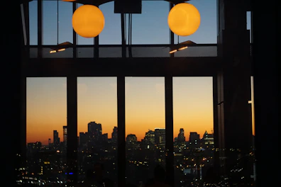View of the city from the suite’s large windows at sunset.