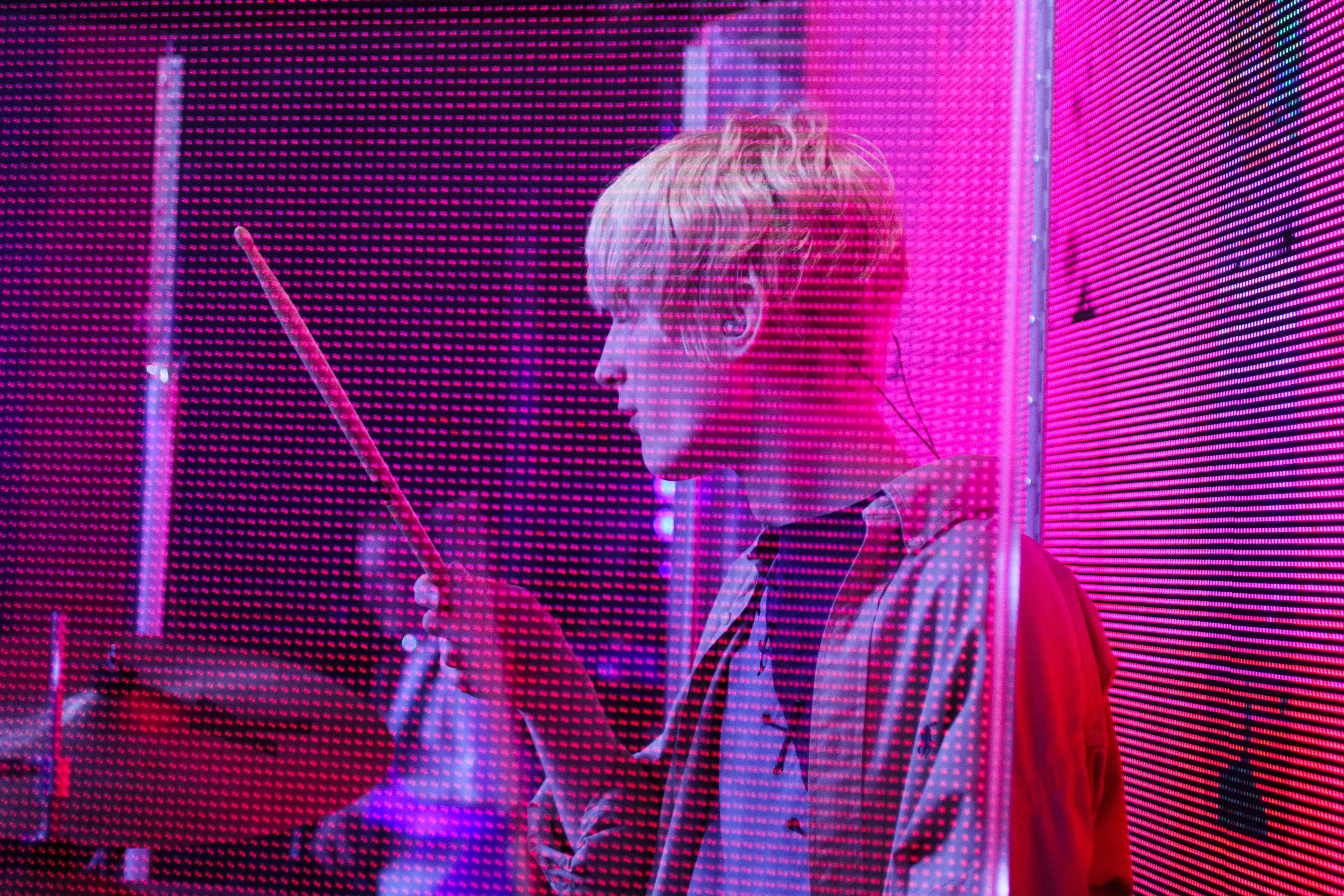 man holding drum stick photo