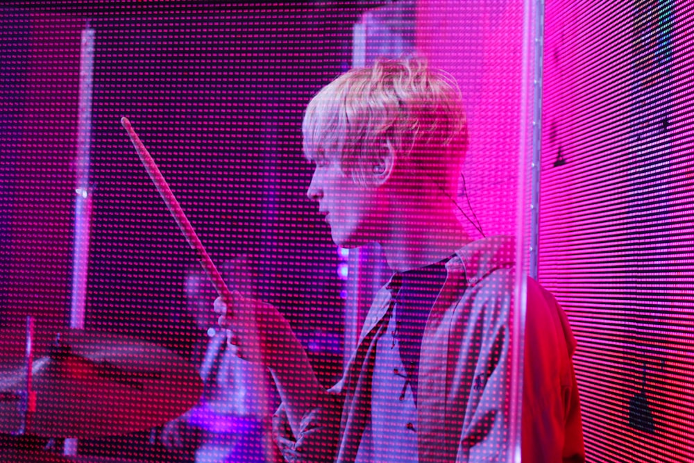 man holding drum stick photo