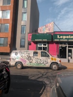 Close-up of the Shiptospain logo on the side of a clean white cargo van