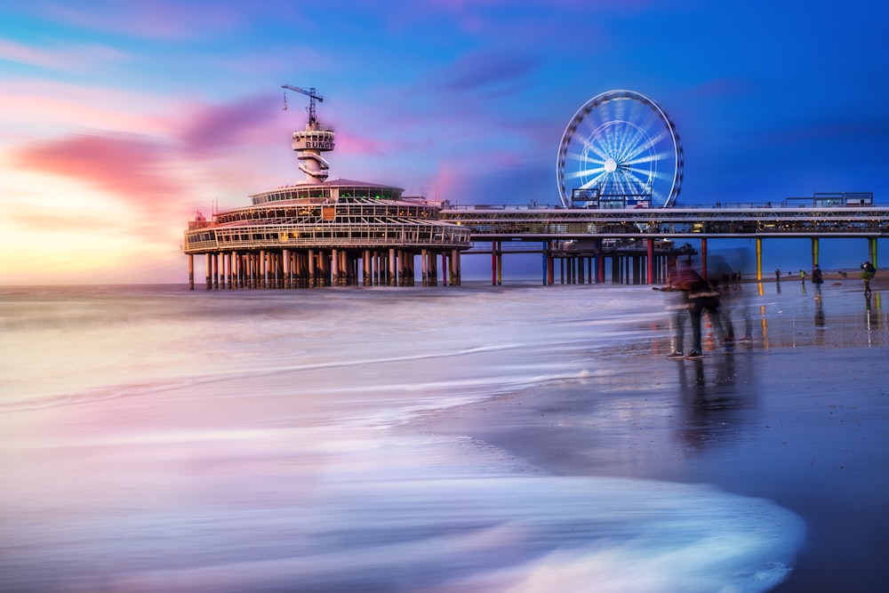 person walking by the sea time lapse photography