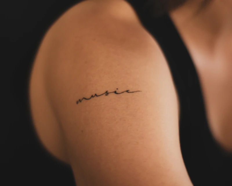 Delicate fine line script tattoo