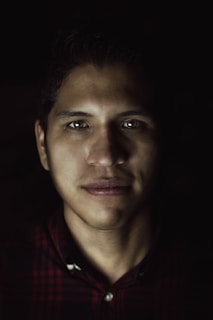 A serene portrait of a ministry leader against a dark background, showcasing the power of quick, professional edits.