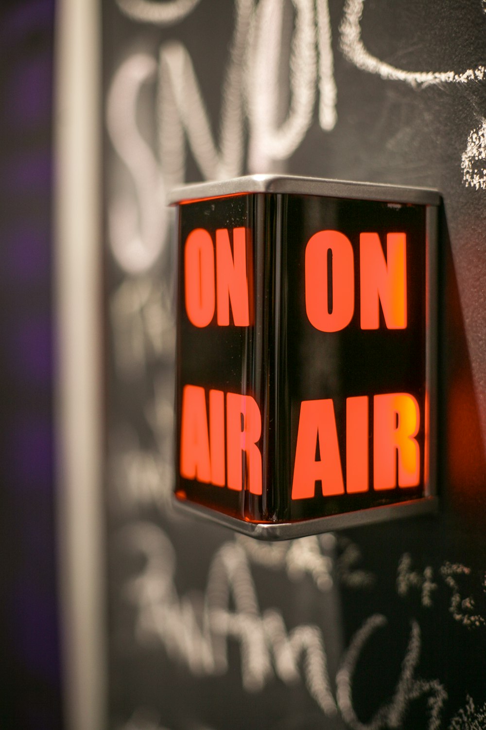 selective focus photography of on air signage