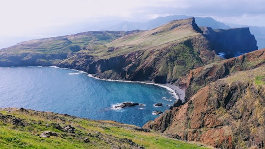 aerial view of body of water and mountain in Ponta de São Lourenço Portugal