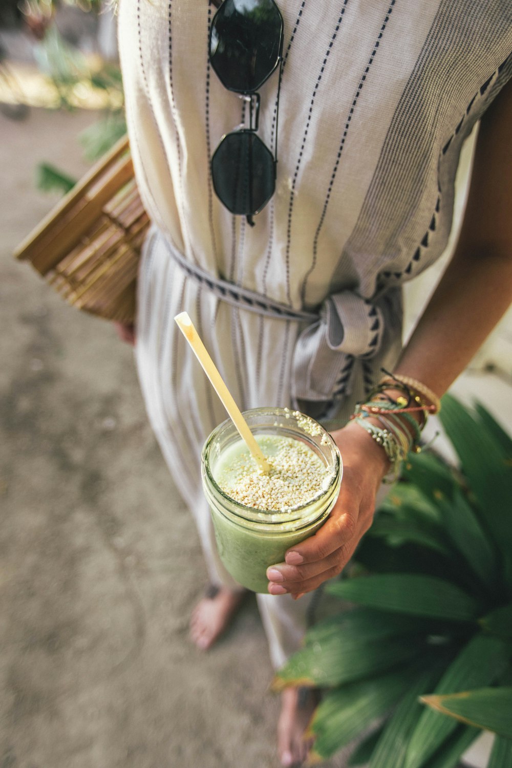 person holding glass cup