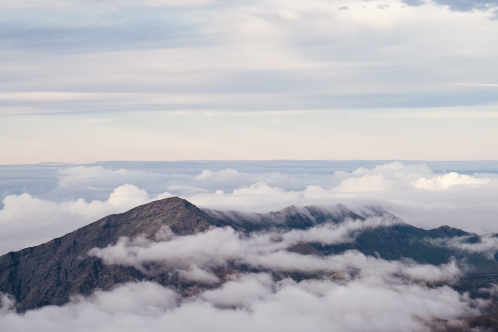 landscape photography of mountain surrounded with clouds