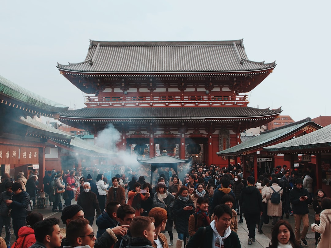 people in front of red temple