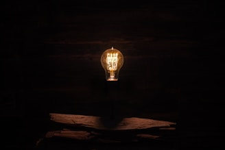 lighted incandescent lamp on wall
