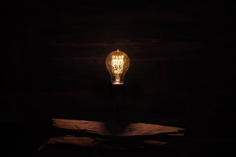 lighted incandescent lamp on wall