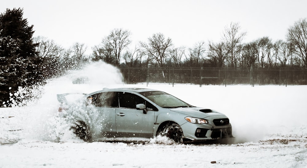 car running on snow covered ground