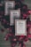 Three boxes of handmade soap labeled 'Rose Basil' from Vya Naturals are arranged on a surface surrounded by scattered red rose petals. The boxes are neatly aligned, displaying their minimalist design with a focus on natural ingredients.