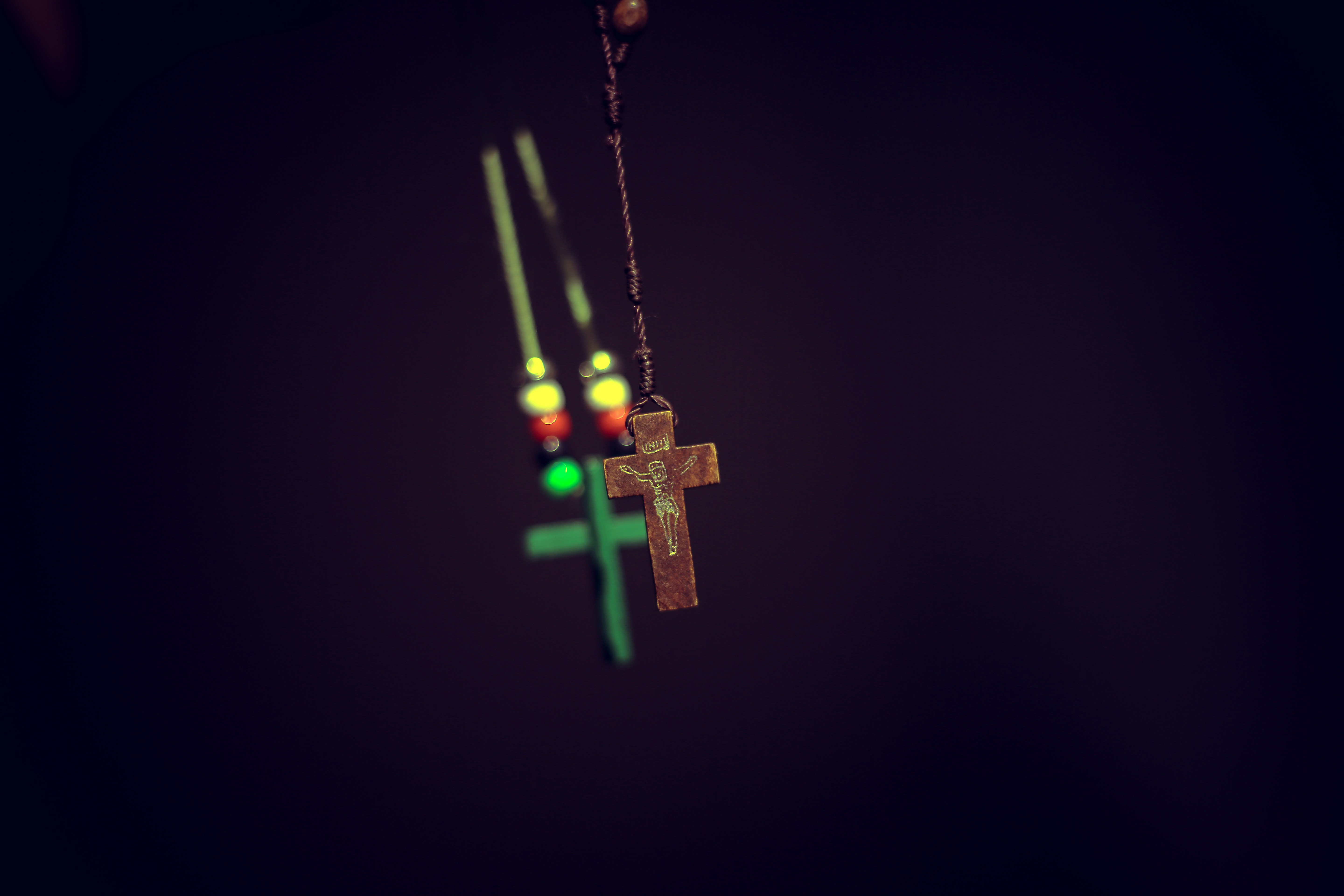 brown wooden cross pendant
