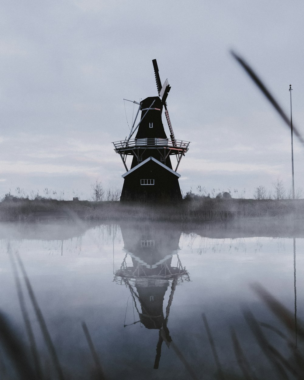 windmill across lake