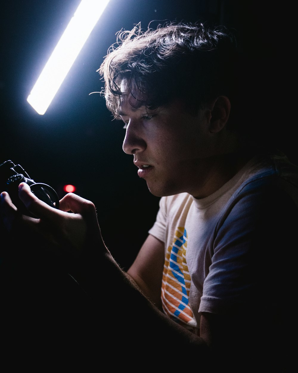 man holding black gadget