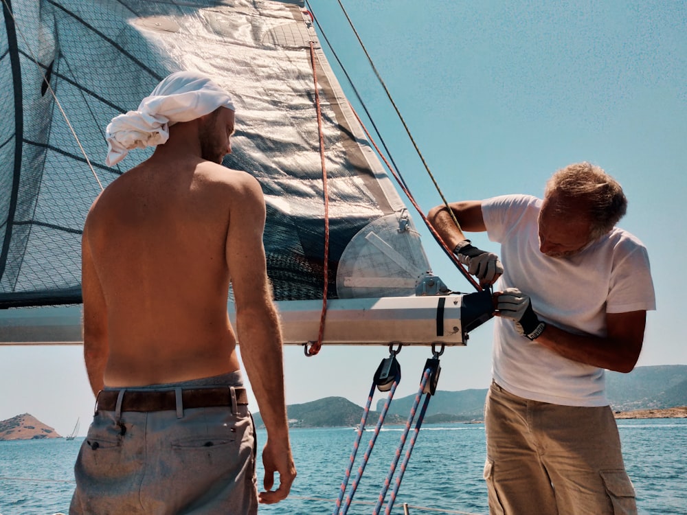 man fixing boat part