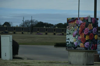 Colorful billboard showcasing a recent campaign by Hilay Flower in a bustling city street.