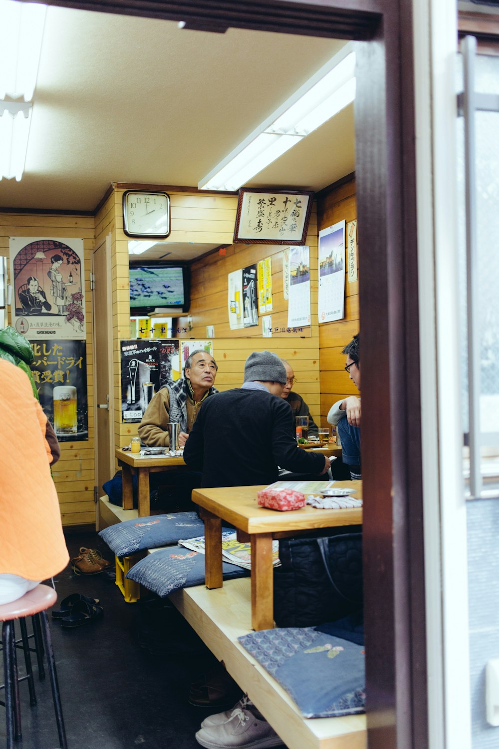 people eating sitting in front of table