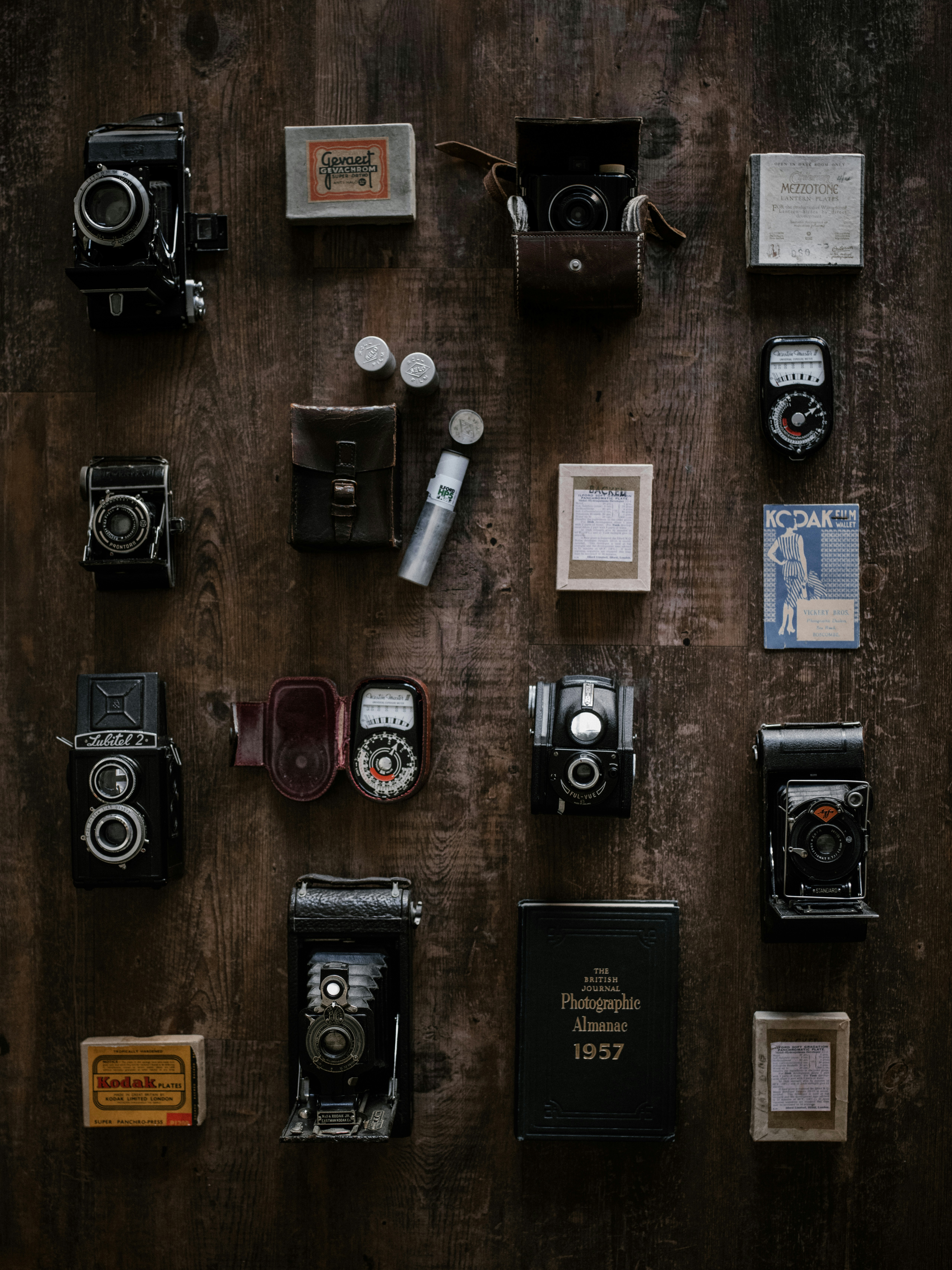 flat lay photography of assorted DSLR cameras