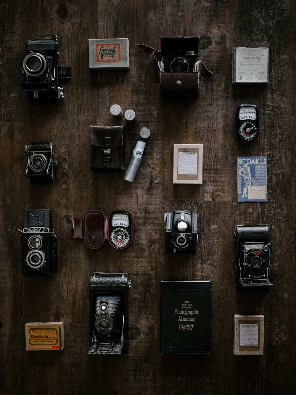 flat lay photography of assorted DSLR cameras