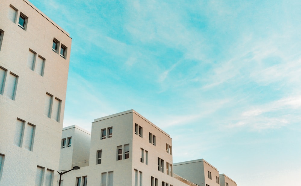 white concrete apartment during daytime