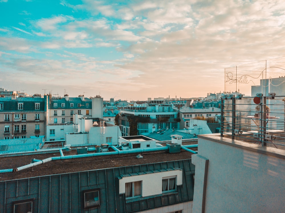 city buildings under cirrus clouds