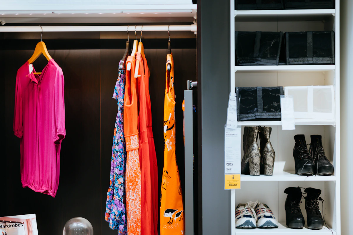 Clothes and shoes neatly arranged inside a fitted wardrobe