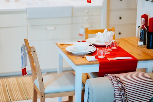 rectangular brown and white wooden table with chairs