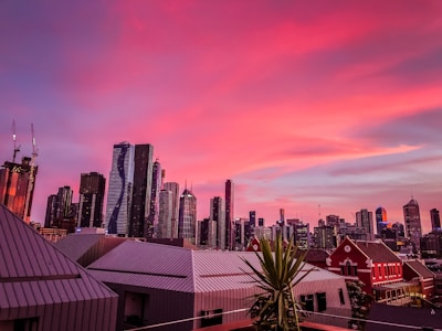 City skyline at sunset highlighting eco-friendly buildings