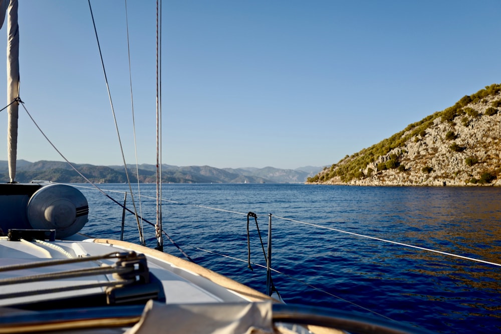 white sailboat on body of water during daytime