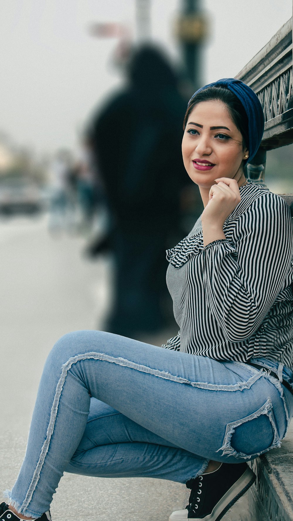 selective focus photography of woman leaning on wall