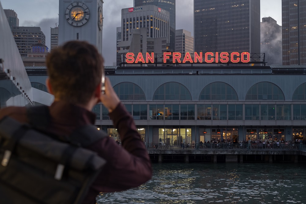 man looking at San Francisco signage