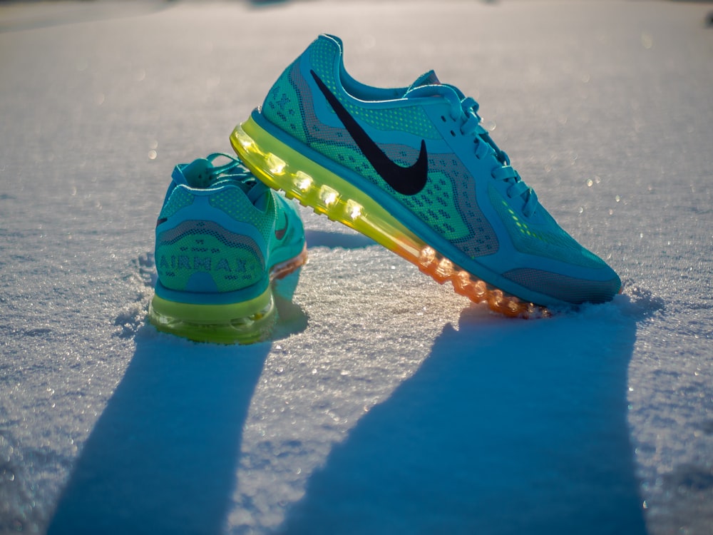 blue Nike shoes on snow