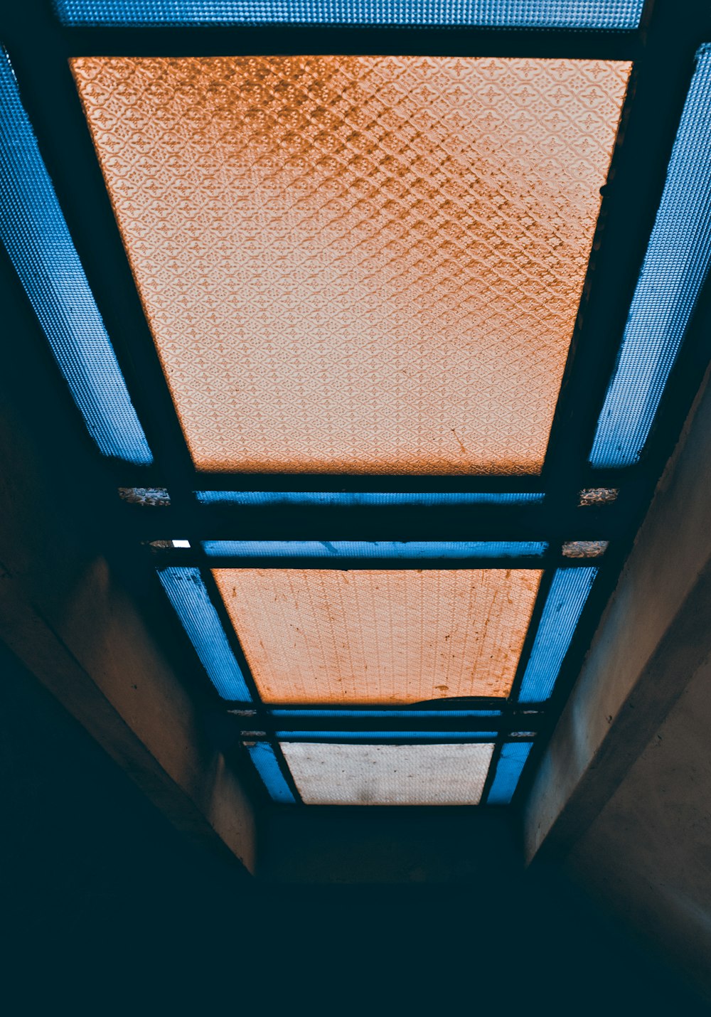 the ceiling of a building with a skylight above it