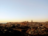 A panoramic view of Ahmedabad’s skyline at sunset with historic landmarks.