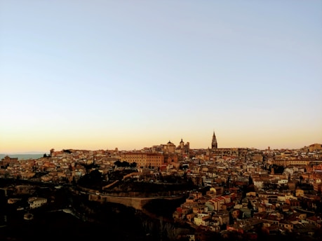A panoramic view of Córdoba's skyline at sunset, showcasing its historical architecture and vibrant colors.