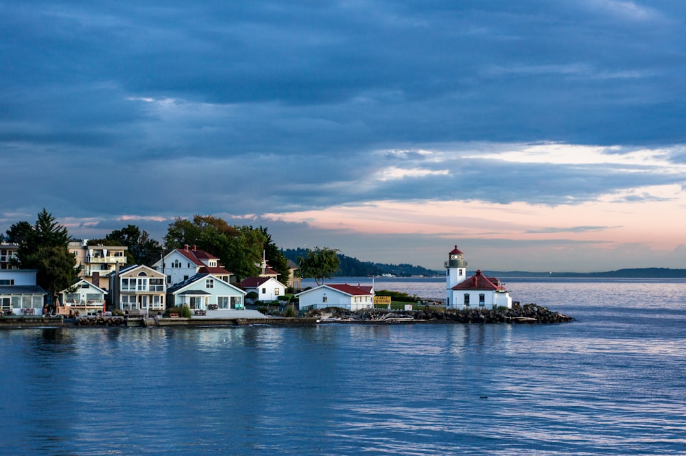 calm body of water surrounded by houses