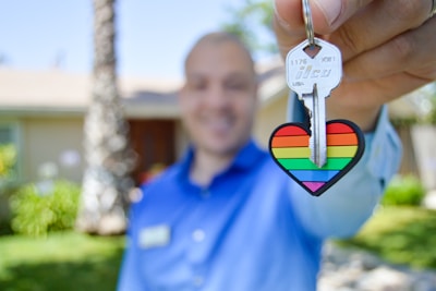 selective photo of gray key with heart key chain