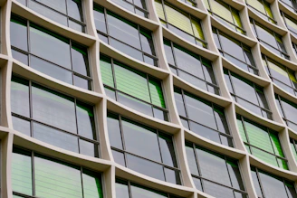 Installation of large glass windows on a contemporary commercial building.